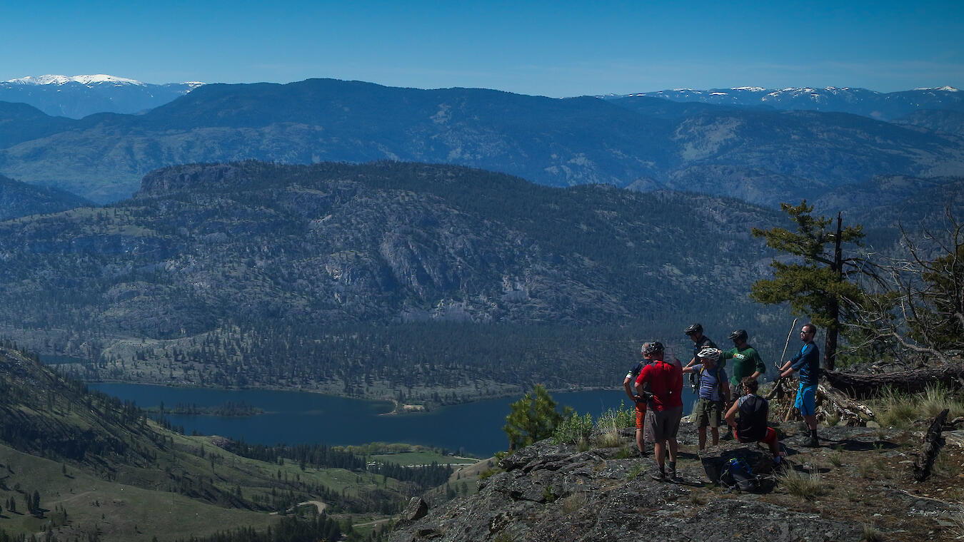 South Okanagan mountain bikers taking in the view above Vaseux Lake